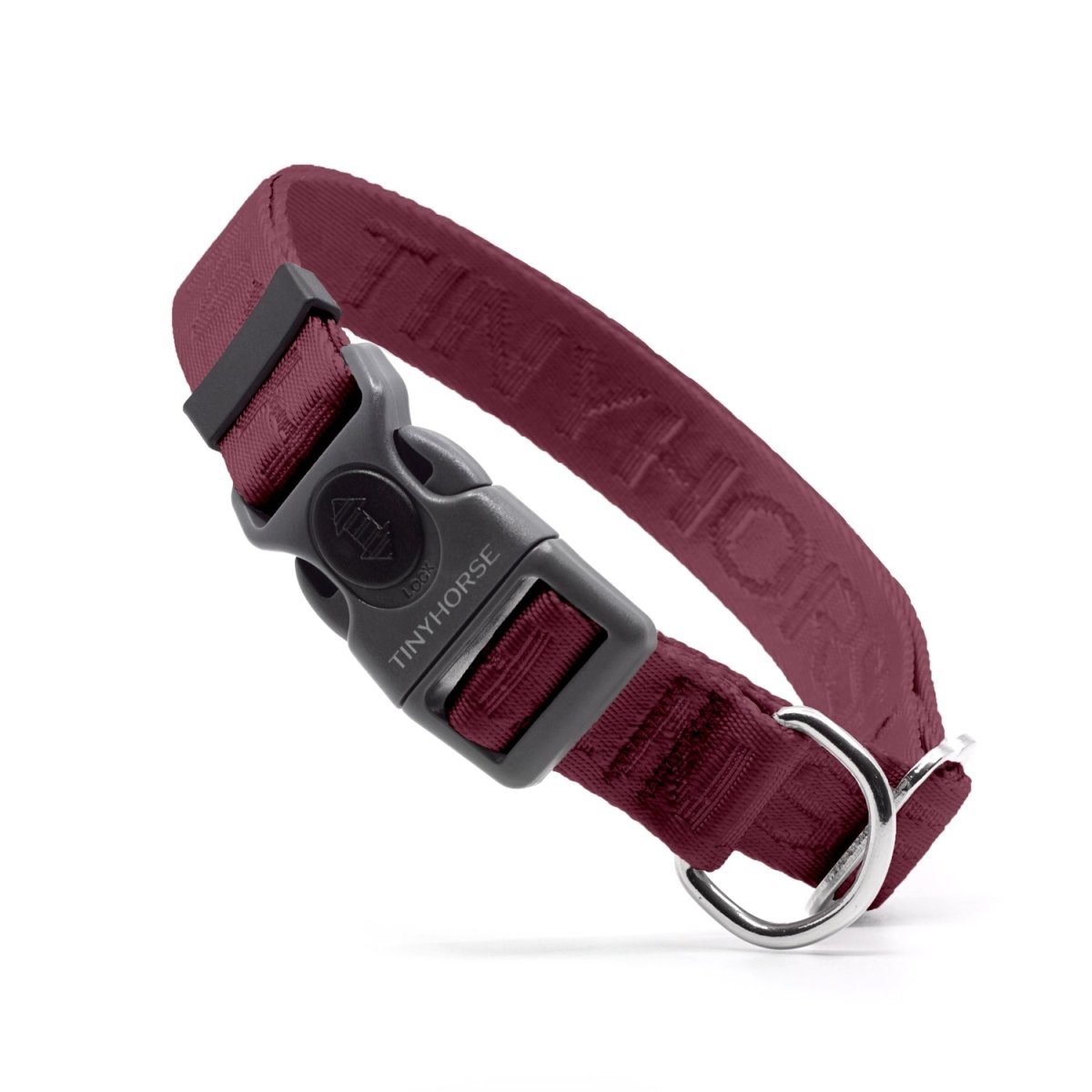 Burgundy dog collar with grey plastic locking buckle. Adjustable metal slide and dee ring for ID tags.