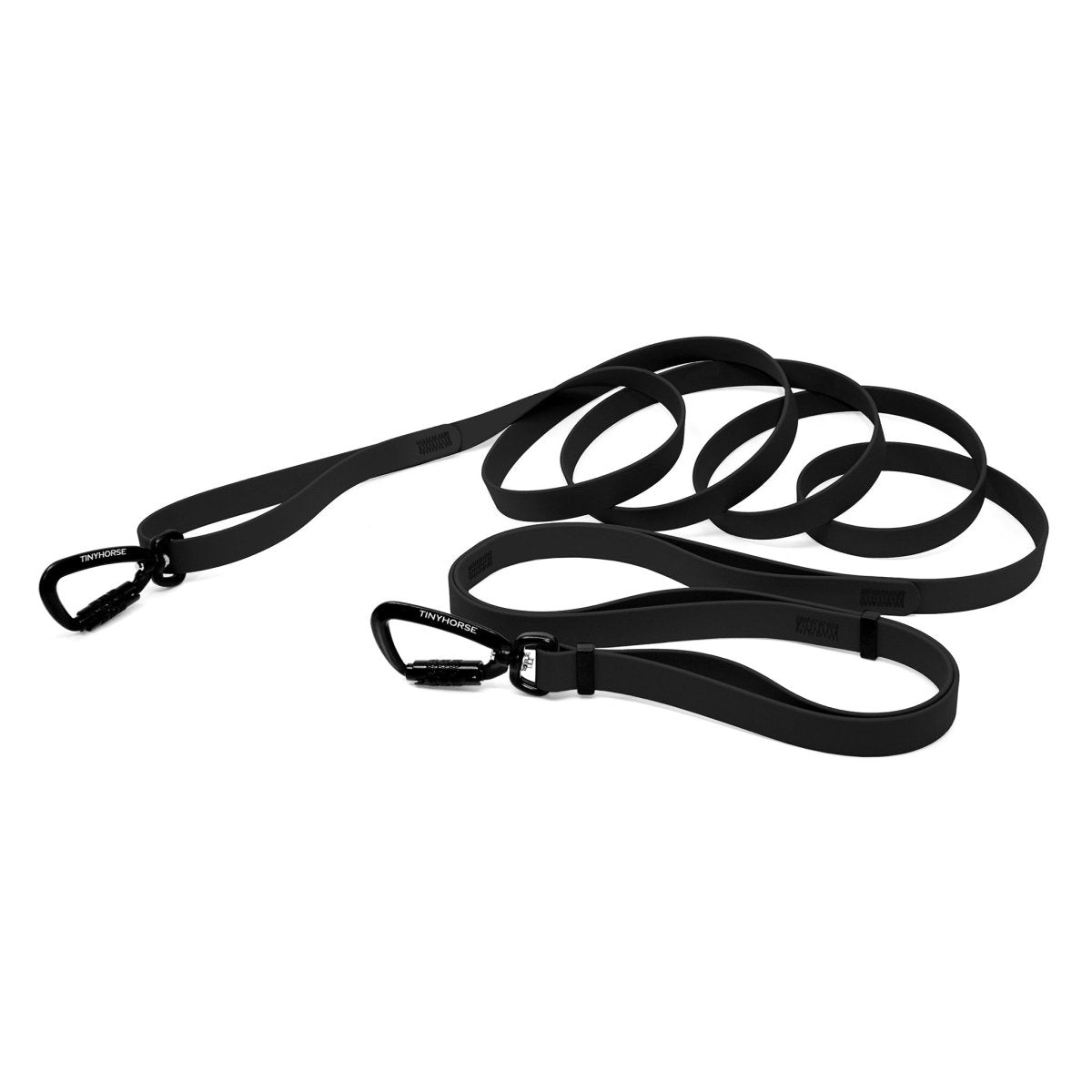 A black bio thane infinite pro dog leash with two auto-locking carabiners on a white background.