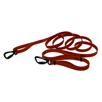 A chilli red bio thane infinite pro dog leash with two auto-locking carabiners on a white background.