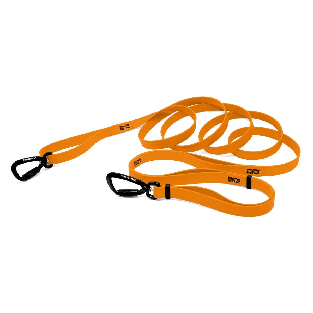 A pastel orange bio thane infinite pro dog leash with two auto-locking carabiners on a white background.