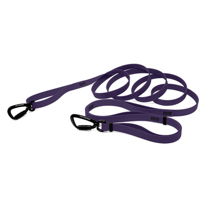 A purple bio thane infinite pro dog leash with two auto-locking carabiners on a white background.