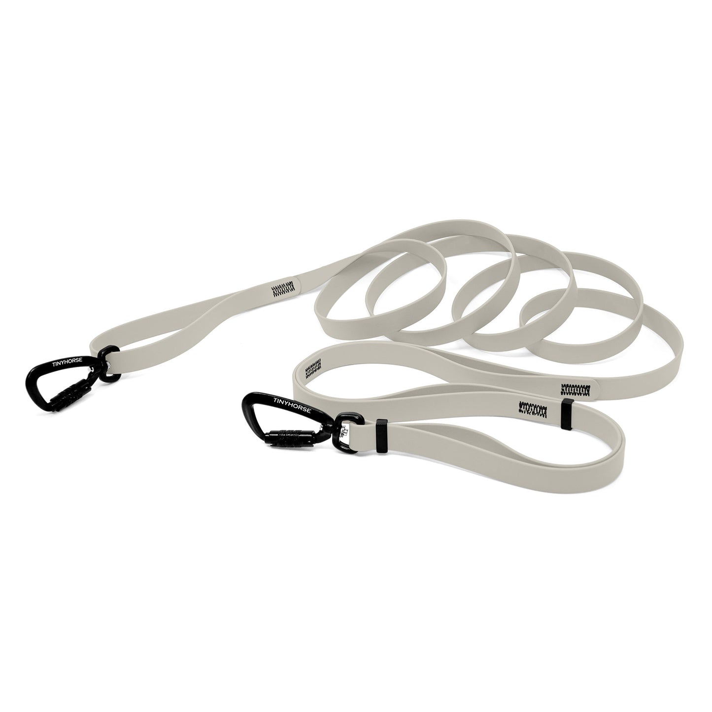 A white bio thane infinite pro dog leash with two auto-locking carabiners on a white background.