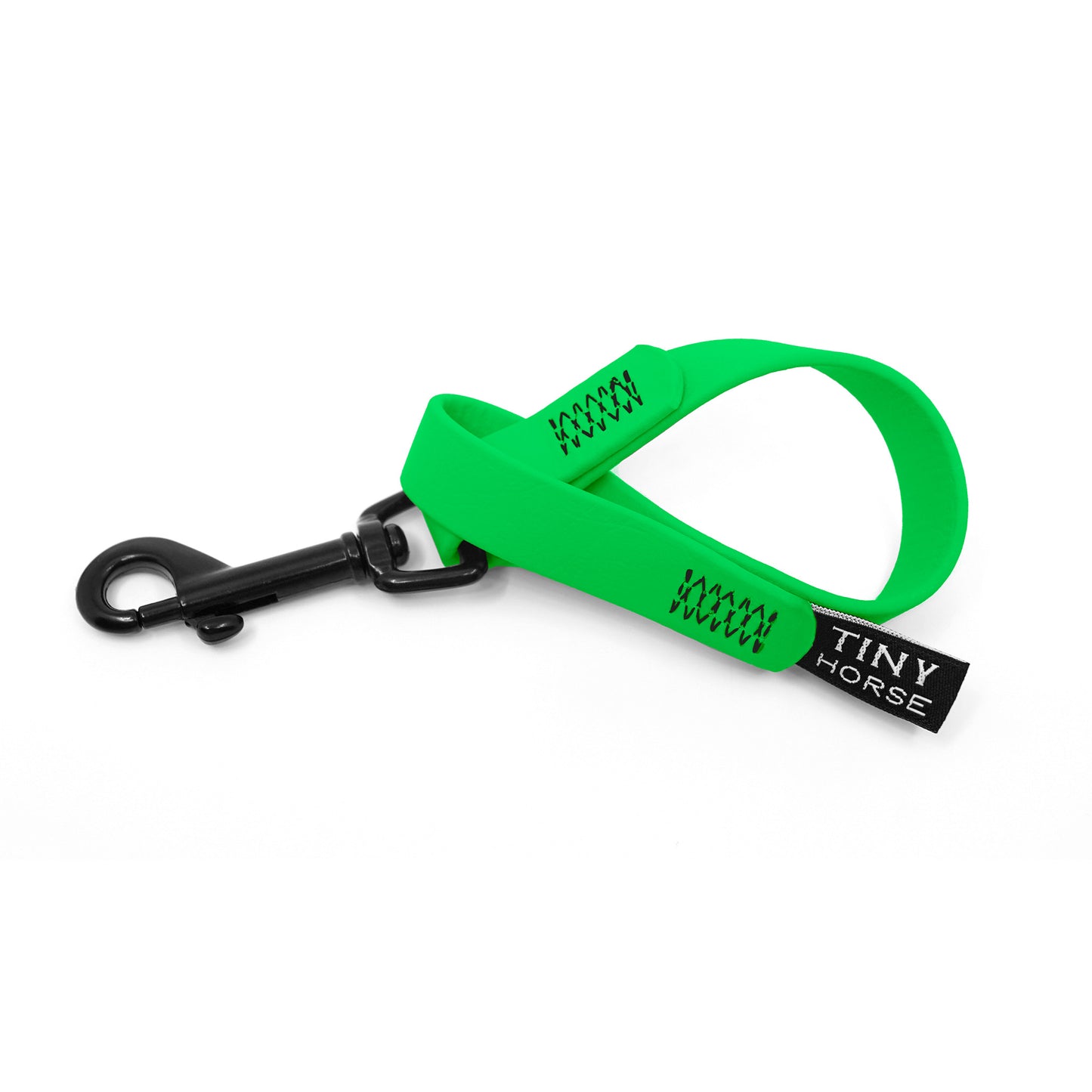 A neon green keeper in bio thane with a black trigger clip on a white background.