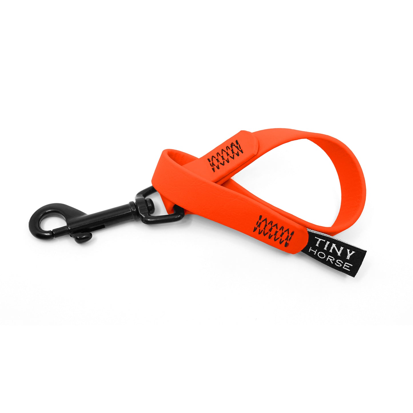 A neon orange keeper in bio thane with a black trigger clip on a white background.