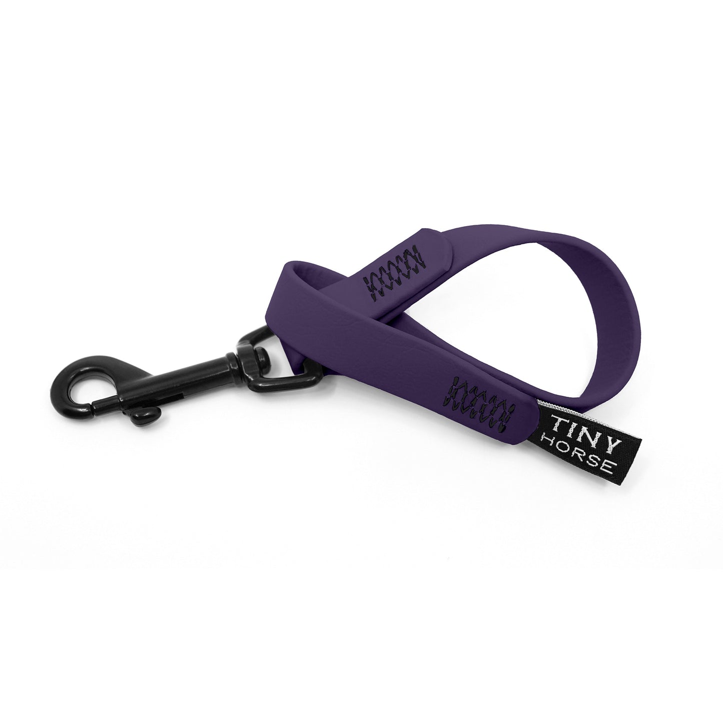 A purple keeper in bio thane with a black trigger clip on a white background.