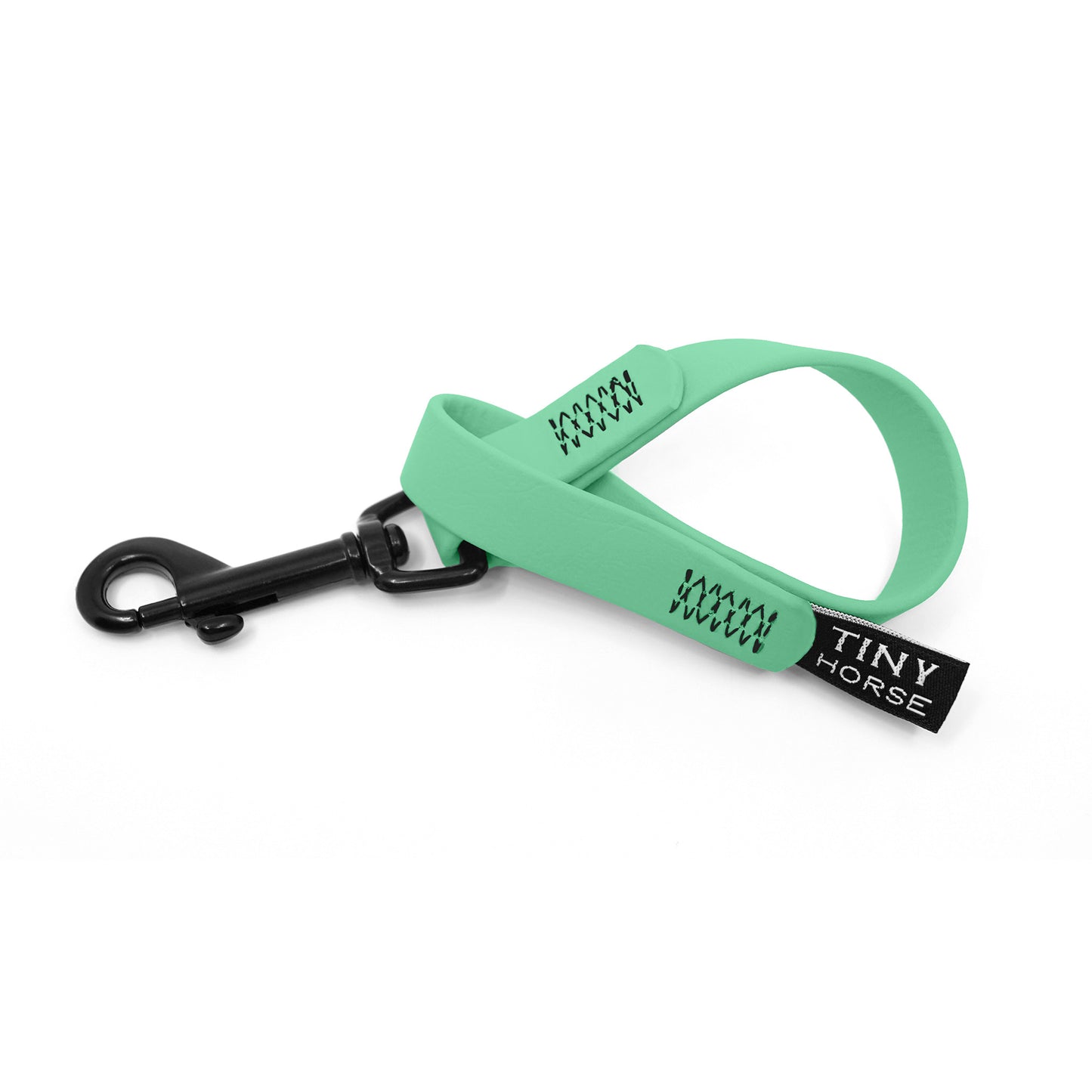 A seafoam keeper in bio thane with a black trigger clip on a white background.