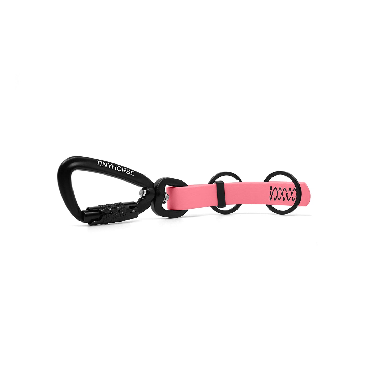 A baby pink key chain with an auto-locking carabiner and two split rings on a white background.
