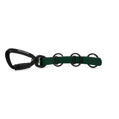 A extra long dark green key chain with an auto-locking carabiner and three split rings on a white background.