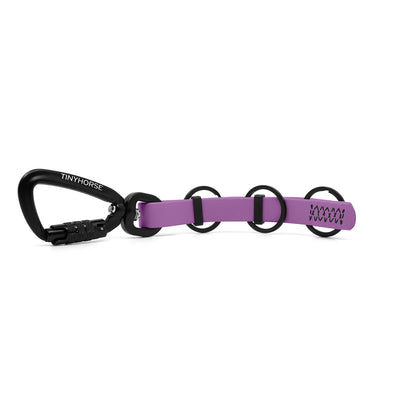 A extra long lilac key chain with an auto-locking carabiner and three split rings on a white background.