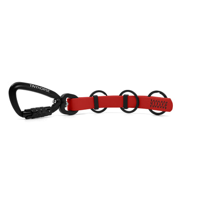 A extra long red key chain with an auto-locking carabiner and three split rings on a white background.