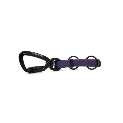 A purple key chain with an auto-locking carabiner and two split rings on a white background.