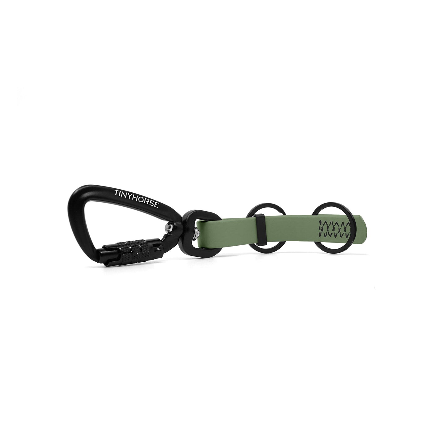 A sage key chain with an auto-locking carabiner and two split rings on a white background.