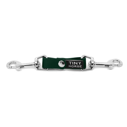 A dark green security strap on bio thane with two silver triggers on a white background.