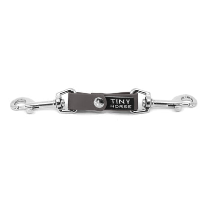 A grey security strap on bio thane with two silver triggers on a white background.