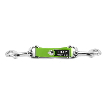 A lime security strap on bio thane with two silver triggers on a white background.