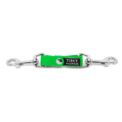 A neon green security strap on bio thane with two silver triggers on a white background.