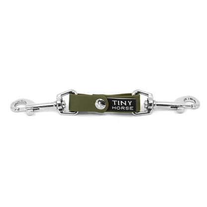 A olive security strap on bio thane with two silver triggers on a white background.